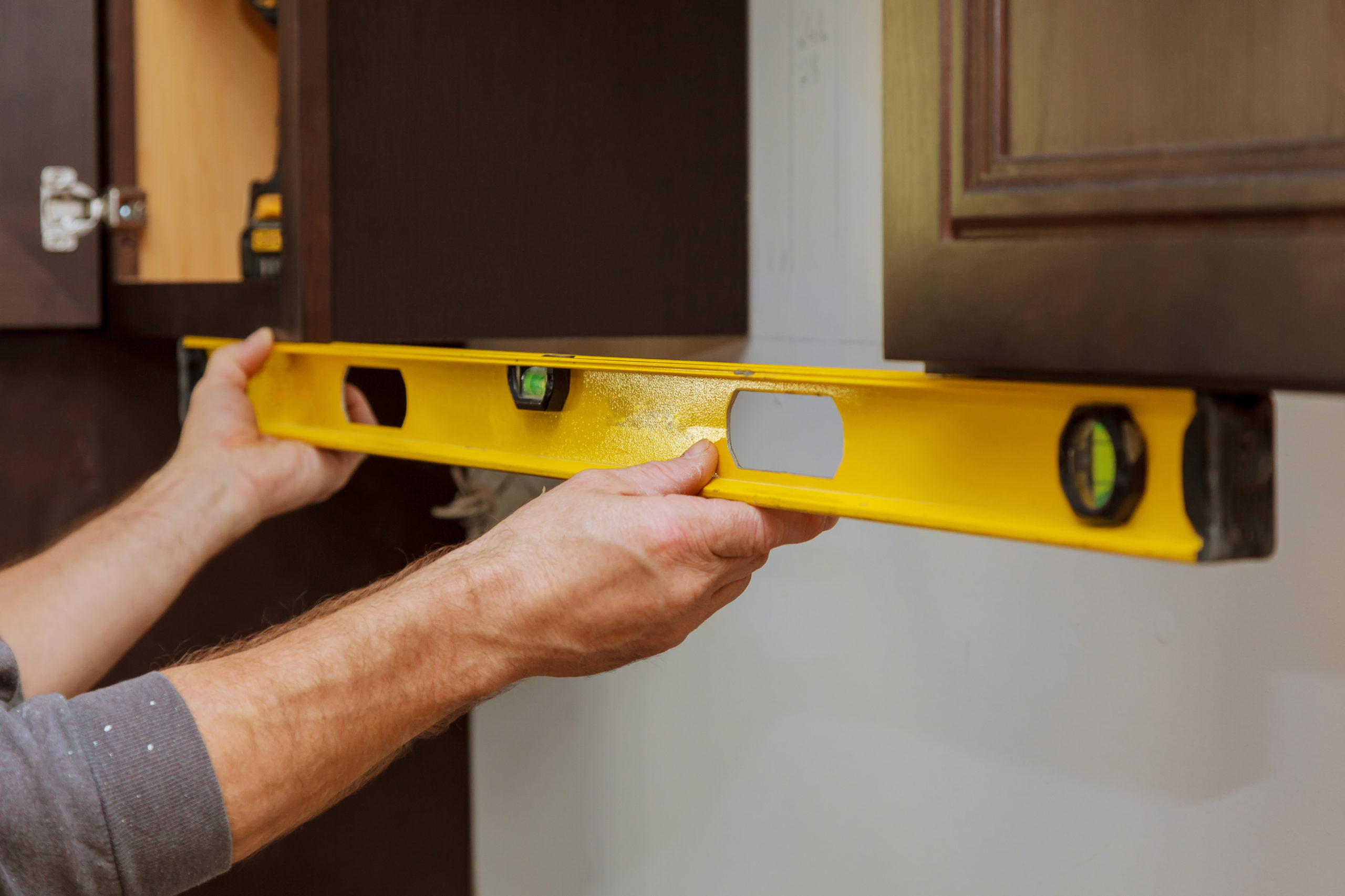 How to Hang Upper Cabinets by Yourself
