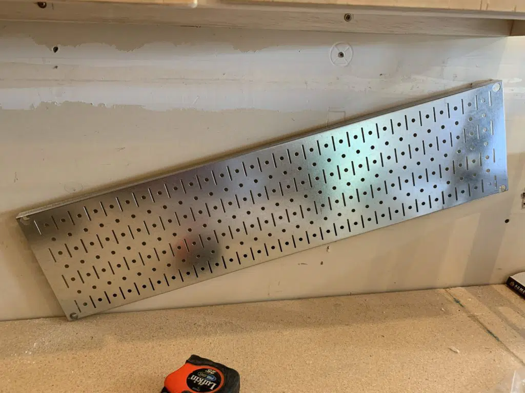 installing pegboard organizer upper hole first