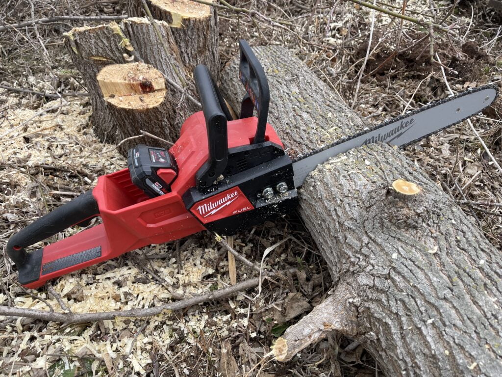 Battery Powered Chainsaw Cutting Firewood